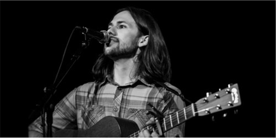 Justin Hillman performs at the release party for "Have I Not Found You Yet," at performs at the Whitney Center for the Arts, November 20; photo by Carly Rae.