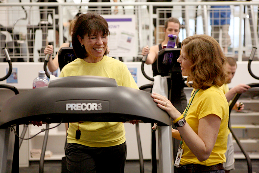 A YMCA trainer discusses fitness goals with a participant in LIVESTRONG at the YMCA; photo courtesy LIVESTRONG.