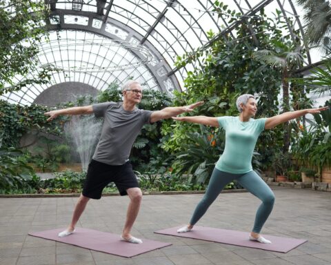 couple practicing yoga