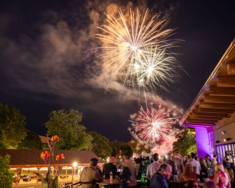 Fireworks light up the night sky above guests attending Summer SPACtacular at Saratoga Performing Arts Center.