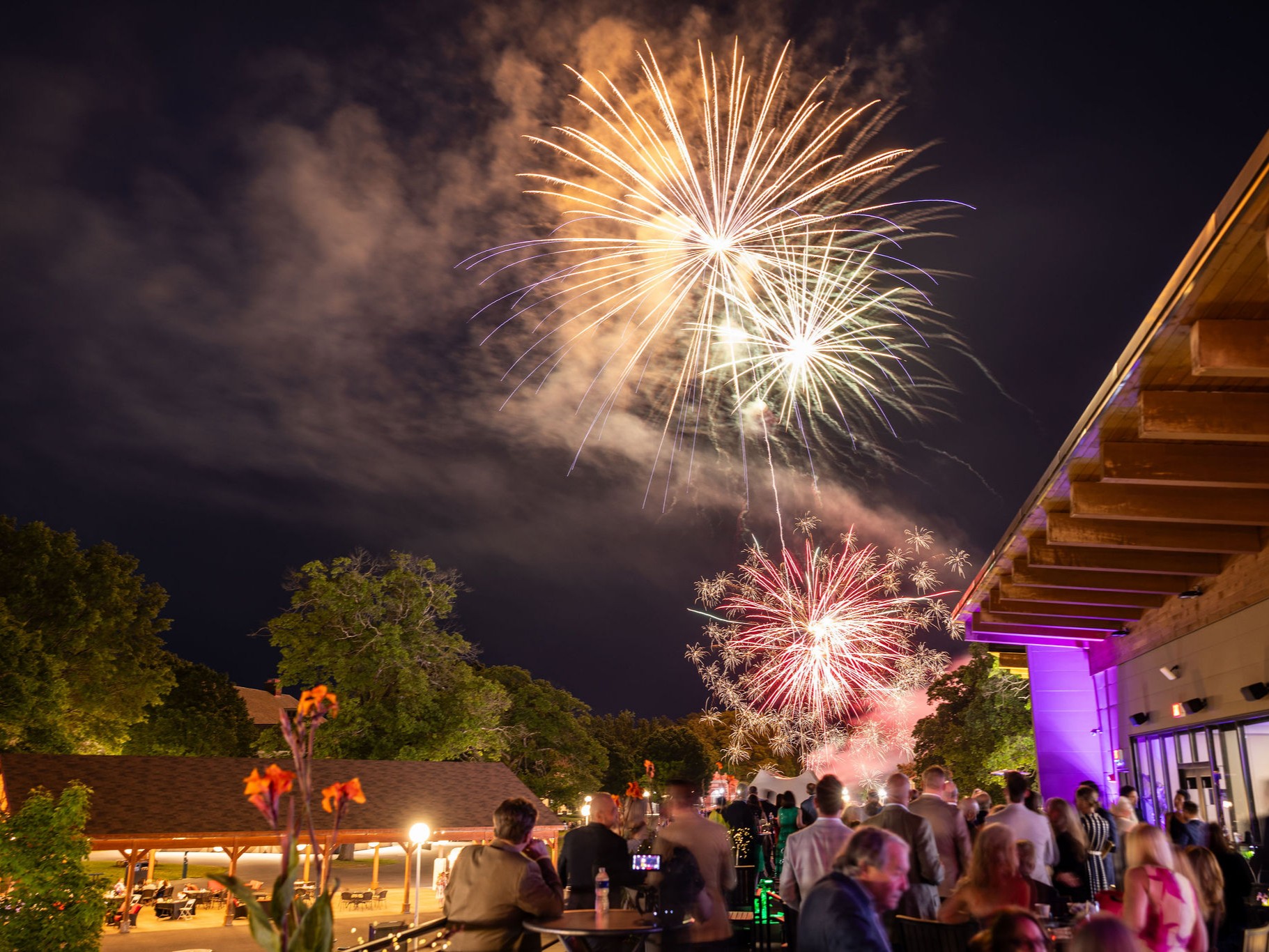 Fireworks light up the night sky above guests attending Summer SPACtacular at Saratoga Performing Arts Center.