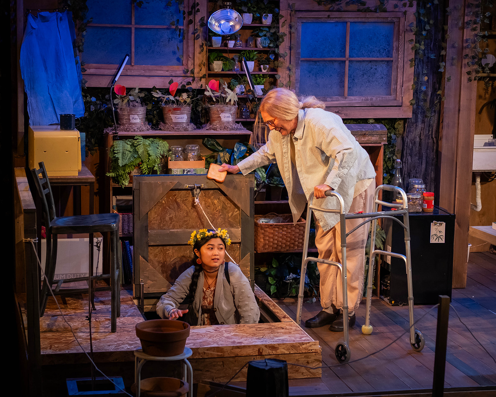 Actors Mei MacQuarrie, left, and Cate Damon perform in WAM Theatre’s production of ROOTED in Lenox, Mass., a Berkshire-based play exploring community, connection, and environmental themes through the story of a woman living in a treehouse.