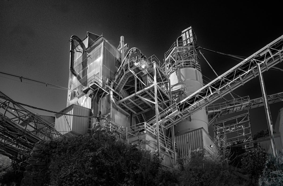 Black-and-white photograph of industrial structures at the Specialty Minerals plant in Adams.