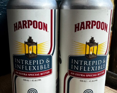 Two cans of Hot Plate Brewing Co.'s Intrepid & Inflexible Extra Special Bitter stand side by side. Brewed in collaboration with Harpoon Brewery, the Colonial-inspired ale was created to mark the 250th anniversary of American independence.